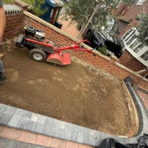 leveling and compacting flower bed